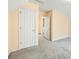 Bedroom features an open door and a closed door, plus lots of natural light from a window at 285 Blackstock Rd, Villa Rica, GA 30180