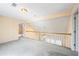Open bonus room area with railing and light fixtures at 285 Blackstock Rd, Villa Rica, GA 30180