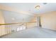 Open bonus room area with railing and light fixtures at 285 Blackstock Rd, Villa Rica, GA 30180
