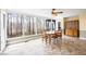 Sunroom dining area boasting natural light and scenic outdoor views from large windows at 285 Blackstock Rd, Villa Rica, GA 30180