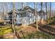View of home's exterior with screened porch and sunroom at 285 Blackstock Rd, Villa Rica, GA 30180