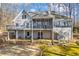 Exterior view of home with backyard, deck, screened porch, and sunroom at 285 Blackstock Rd, Villa Rica, GA 30180
