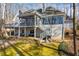 Back exterior view of home with deck, screened porch and large sunroom at 285 Blackstock Rd, Villa Rica, GA 30180