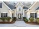 Stunning home with stone steps, sidelights, gray facade, dark shutters, and mature landscaping at 285 Blackstock Rd, Villa Rica, GA 30180