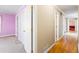 Hallway featuring hardwood floors with views of adjacent rooms. Great flow at 285 Blackstock Rd, Villa Rica, GA 30180