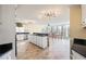 Open-concept kitchen with tile floors, granite countertops, white cabinets, and stainless steel appliances at 285 Blackstock Rd, Villa Rica, GA 30180