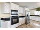 Kitchen with stainless steel appliances, granite countertops, and white cabinets at 285 Blackstock Rd, Villa Rica, GA 30180