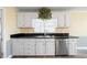 Kitchen featuring white cabinets, granite countertops, and stainless steel dishwasher at 285 Blackstock Rd, Villa Rica, GA 30180