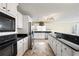 Spacious kitchen with white cabinets, granite countertops and stainless steel appliances at 285 Blackstock Rd, Villa Rica, GA 30180