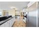 Open kitchen featuring stainless steel appliances, white cabinetry, and black countertops at 285 Blackstock Rd, Villa Rica, GA 30180