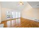 Bright living room featuring hardwood floors, vaulted ceiling, and natural light with a door to outside at 285 Blackstock Rd, Villa Rica, GA 30180