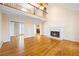 Spacious living room with hardwood floors, fireplace, and open doorway to dining room, perfect for entertaining at 285 Blackstock Rd, Villa Rica, GA 30180