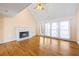 Cozy living room with a white fireplace, hardwood floors, and access to a porch through glass doors at 285 Blackstock Rd, Villa Rica, GA 30180