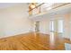 Open living room with hardwood floors, balcony, and doorways leading to other areas of the home at 285 Blackstock Rd, Villa Rica, GA 30180