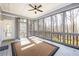 Inviting screened porch with ample natural light and peaceful views of wooded area at 285 Blackstock Rd, Villa Rica, GA 30180