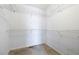 Empty walk-in closet features wire shelving and space for organizing clothes and storage at 285 Blackstock Rd, Villa Rica, GA 30180