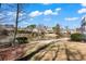 Expansive backyard featuring a view of the lake and neighborhood, perfect for outdoor activities and relaxation at 160 Antler Trl, Alpharetta, GA 30005