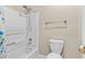 Clean white bathroom with a shower-tub combination and a toilet, highlighted by a gold towel rack at 160 Antler Trl, Alpharetta, GA 30005