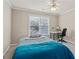 Bright bedroom with ceiling fan, desk, and window letting in natural light at 160 Antler Trl, Alpharetta, GA 30005