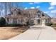Charming two-story home with a well-manicured lawn and inviting curb appeal at 160 Antler Trl, Alpharetta, GA 30005