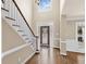 Elegant foyer with hardwood floors, a staircase, and a decorative front door with sidelights at 160 Antler Trl, Alpharetta, GA 30005