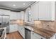 Well-equipped kitchen featuring granite countertops, stainless steel appliances, white cabinets, and hardwood floors at 160 Antler Trl, Alpharetta, GA 30005