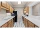 Efficient galley kitchen featuring ample cabinetry, white countertops, and appliances at 160 Antler Trl, Alpharetta, GA 30005