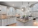 Gourmet kitchen with granite countertops, stainless steel appliances, and a large island cooktop at 160 Antler Trl, Alpharetta, GA 30005