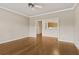 Open-concept living room offering hardwood floors and view to the kitchen at 160 Antler Trl, Alpharetta, GA 30005