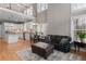 Open floor plan showcases a modern kitchen, dining area, and comfortable living space at 160 Antler Trl, Alpharetta, GA 30005