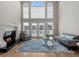 Bright living room with a fireplace, large windows, and a door to the outside at 160 Antler Trl, Alpharetta, GA 30005