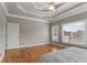 Bright and airy main bedroom featuring hardwood floors, tray ceilings, and ample natural light at 160 Antler Trl, Alpharetta, GA 30005
