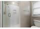 Modern shower room features glass enclosure and neutral color palette at 160 Antler Trl, Alpharetta, GA 30005