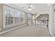 Bright upstairs landing area featuring large windows, a ceiling fan and neutral carpet at 160 Antler Trl, Alpharetta, GA 30005