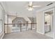 Spacious upstairs landing with neutral carpet, ceiling fan, view of the lower level, and adjacent vanity at 160 Antler Trl, Alpharetta, GA 30005