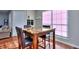 Bright dining area with a marble-top table and seating for two, near a window at 586 Windchase Ln, Stone Mountain, GA 30083