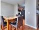 Cozy dining area by the kitchen with a counter and a dark table with a marble top at 586 Windchase Ln, Stone Mountain, GA 30083