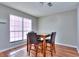 Bright dining area with a modern table set by a large window that lets in natural light at 586 Windchase Ln, Stone Mountain, GA 30083