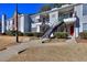 Attractive condo complex featuring neat landscaping, symmetrical stairs, and neutral paint at 586 Windchase Ln, Stone Mountain, GA 30083