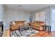 Inviting living room with fireplace, plush sofas, hardwood flooring, and stylish rug at 586 Windchase Ln, Stone Mountain, GA 30083