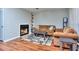 Inviting living room with fireplace, plush sofas, hardwood flooring, and stylish rug at 586 Windchase Ln, Stone Mountain, GA 30083