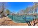 This tennis court surrounded by a fence is a great place to get some exercise in the sun at 586 Windchase Ln, Stone Mountain, GA 30083
