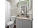 Well-lit bathroom featuring a granite vanity and a shower with a curtain at 1106 Rock Creek Ln, Norcross, GA 30093