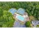 Community pool and tennis courts surrounded by lush greenery and mature trees at 274 Westchester Club Dr, Hiram, GA 30141