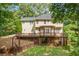 Expansive back deck area with a pergola, overlooking a well-maintained lawn and garden at 274 Westchester Club Dr, Hiram, GA 30141