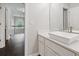 Upstairs bathroom with a modern vessel sink and a view to the landing with iron railing at 274 Westchester Club Dr, Hiram, GA 30141
