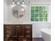 Bathroom with vessel sink, dark wood vanity, subway tile, and a window with natural light at 274 Westchester Club Dr, Hiram, GA 30141
