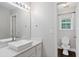 Modern bathroom featuring a white vessel sink and views into the water closet at 274 Westchester Club Dr, Hiram, GA 30141