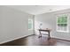 Bedroom featuring hardwood floors, a wooden desk and natural light from a window at 274 Westchester Club Dr, Hiram, GA 30141