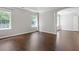 Large bedroom with hardwood floors, large windows, and an arched entryway at 274 Westchester Club Dr, Hiram, GA 30141